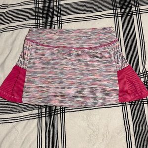 Pink and rainbow tennis skirt. With shorts underneath. In great condition.